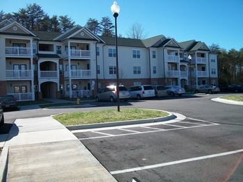 Apartment building with a parking lot